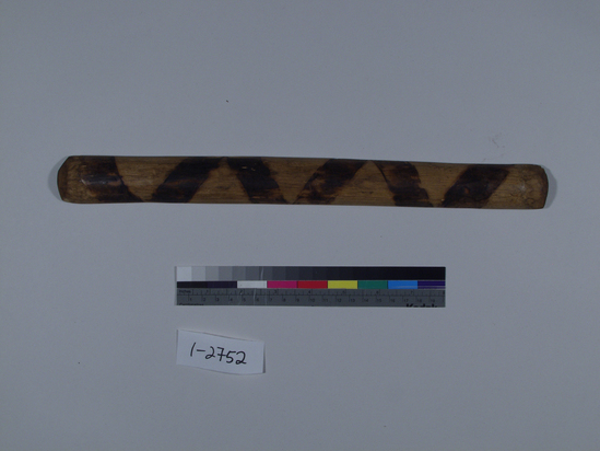 Hearst Museum object titled Gambling stave, accession number 1-2752, described as Wood, half - round, charred decoration on round surface. Polished from usage. One of set 1-2750-56.