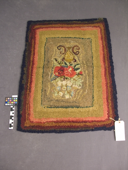 Hearst Museum object titled Rug, accession number 2-36920, described as Hooked rug with floral design, wool on burlap, varicolored