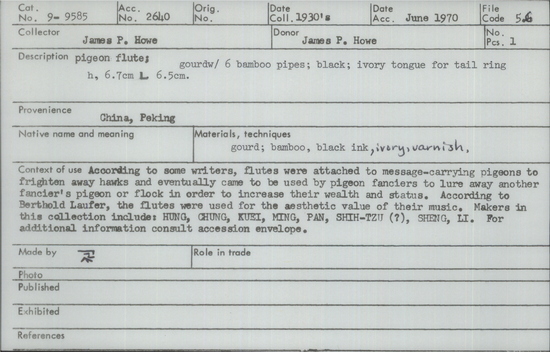 Documentation associated with Hearst Museum object titled Pigeon flute, accession number 9-9585, described as pigeon flute; gourd w/6 bamboo pipes;black;ivory tongue for tail ring; ht. 6.7 cm. L 6.5 cm.