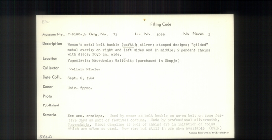 Documentation associated with Hearst Museum object titled Metal belt buckle, accession number 7-5180a,b, described as Woman's metal belt buckle (pafti); silver; stamped designs; "gilded" metal overlay on right and left sides and in middle; 9 pendant chains with discs; 30.5 cm wide