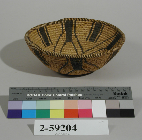 Hearst Museum object titled Basket, accession number 2-59204, described as Coiled, bowl shaped. Black designs of V-shaped lines and solid vertical bars. 3-rod foundation of peeled shoots, sewing strands of split peeled shoots, design in split devil's-claw pods.