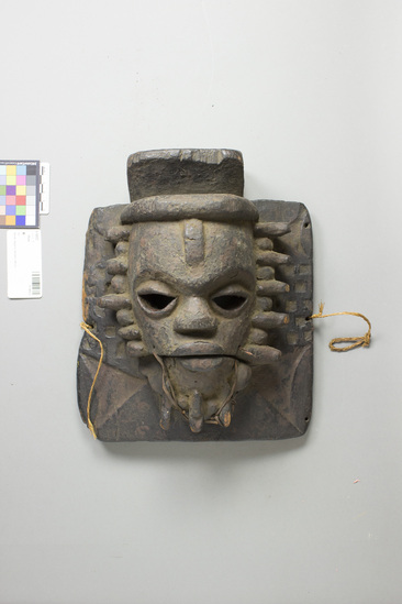 Hearst Museum object titled Mask, accession number 5-14523, described as Wood mask w/ movable jaw. (Rectangular frame, opening mouth, fringe beard), Ozuitem from Bende. 31.3 cm