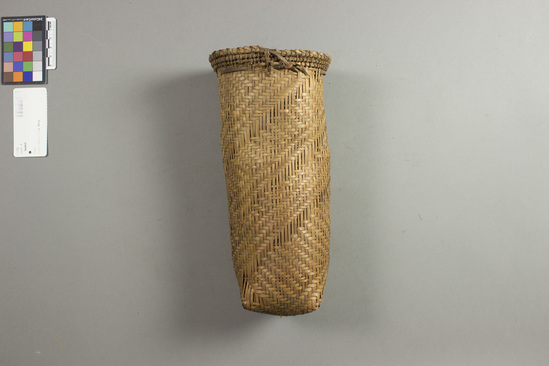 Hearst Museum object titled Basket, accession number 5-1755, described as Women's fishing basket (nkūn); light cylindrical shape, 4" 10.16cm rim diameter, 10" 25.4cm height Woven by women exclusively