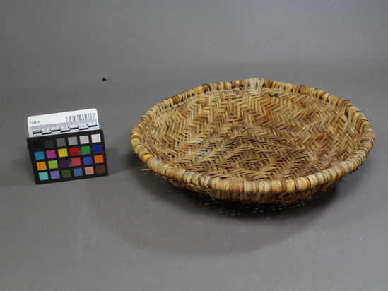 Hearst Museum object 2 of 3 titled Bowl, accession number 2-48554, described as Basketry bowl, ground, twilled yucca leaves.