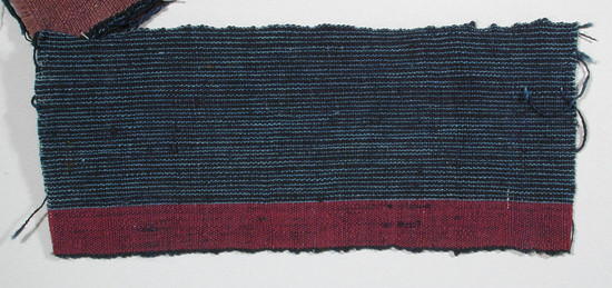 Hearst Museum object titled Textile fragment, accession number 5-11106, described as Textile sample (section of narrow band weaving): Navy ground with fine pale blue lines every .1 cm; wide maroon stripe on right edge.