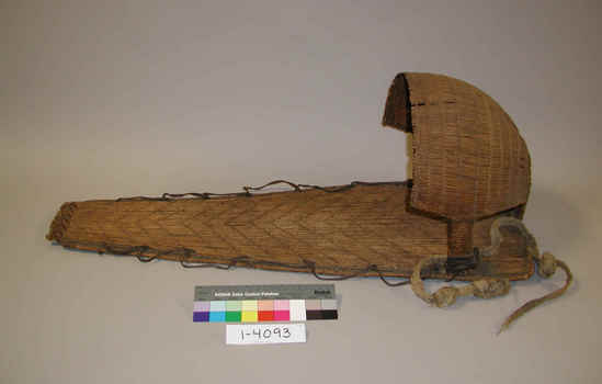 Hearst Museum object titled Cradle, accession number 1-4093, described as Cradle basket; twined. Warp is Redbud (Cercis occidentalis), weft is Sedge (Carex). Red pattern is Redbud. 2 layers of fine sticks bound together. Basketry hood and milkweed fiber strap. Boy patterns on back and hood.