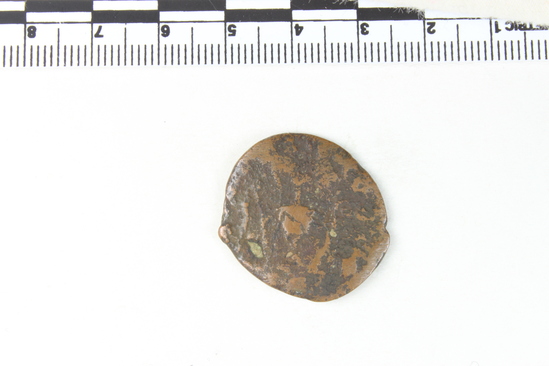 Hearst Museum object 4 of 6 titled Coin: æ, accession number 8-5931, described as Coin: Æ; bronze issue; size: 23.5 mm.; weight: 7.242 grams. Obverse: head of Gordian III (?) facing right, laureate; inscription:- (too blurred to read). Reverse: sacrificial implements (culter, sprinkler, ewer, lituus, simplum); inscription:- (too blurred to read).