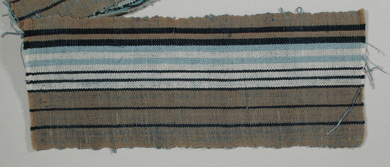 Hearst Museum object titled Textile sample, accession number 5-11161, described as textile sample (section of narrow band weaving):  tan ground;  navy striped, one white panel off center with navy and light blue stripes within;  l. 23.3 x w. 9.1 cms.