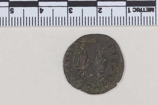 Hearst Museum object 4 of 8 titled Coin: billon antoninianus, accession number 8-4075, described as Coin; Billon; Antoninianus; Roman. 2.81 grams, 22 mm. Aurelian, 270-275 AD. Mediolanum, Italy. Obverse: IMP C AVRELIANVS AVG, Bust r. radiate. Reverse: RESTITVT ORIENTIS, female standing r. presents wreath to emperor in armor, in exergue P