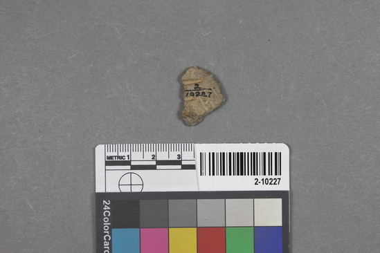 Hearst Museum object titled Potsherd, accession number 2-10227, described as Fragment of baked clay pottery bearing basketry impressions