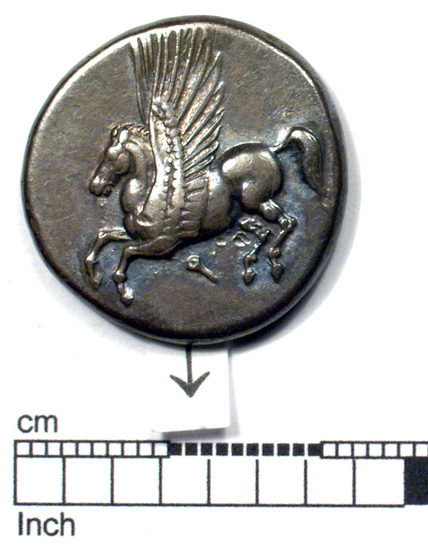 Hearst Museum object 4 of 11 titled Coin: ar stater, accession number 8-5485, described as Coin; AR; Stater; Greek. 8.5435 grams, 21.7 mm.  400-338 BC. Corinth, Greece. Obverse: Pegasus with pointed wings flying l.; below, Ϙ. Reverse: Head of Pallas l. helmeted; to left, “I”; to right, Nike flying l. carrying fillet. Remarks: "condition, excellent.