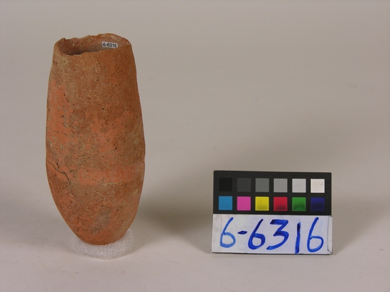 Hearst Museum object titled Beer cup, accession number 6-6316, described as Pottery, deep pointed-bottomed buff cup, badly eroded, rim chipped: least diameter 5 cm, greatest diameter 6.5 cm, height 15 cm