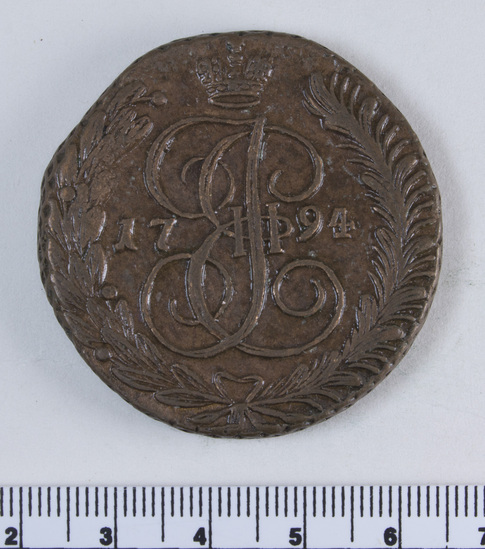 Hearst Museum object 2 of 4 titled Coin, accession number 7-2737, described as Russian coin: obverse: AM; royal crest of a crowned double headed eagle; ПЯТЬ КОПЬЕКЪ; 1794; translation: five kopecks; reverse: royal crest of Catherine II (her initials E and [T?] and Roman numeral II framed by a wreath and topped with a crown).