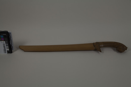 Hearst Museum object 2 of 5 titled Knife, accession number TEMP 2018.1415, described as Javanese parang knife, carved sheath and handle with animal head. overall 22" length.