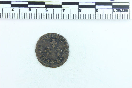 Hearst Museum object titled Coin, accession number 7-3809, described as Coin; Cu; Double tournois; Obverse- Bust of Henry III; Reverse- Fleur de Lis; 1581