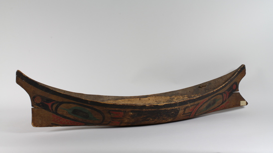 Hearst Museum object 6 of 6 titled Canoe model, accession number 2-10869, described as Model of canoe, painted totemic design in red, green, and black.  Wolf design (fide Charles Brown).