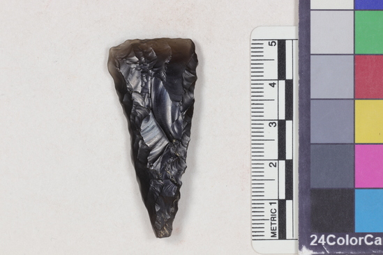 Hearst Museum object titled Projectile point fragment, accession number 16-14318, described as Projectile point fragment; obsidian; triangular; weight: 8.29 grams; length: 5.02 cm; width: 2.28 cm; depth: 0.81 cm; straight sides; straight, broken base.