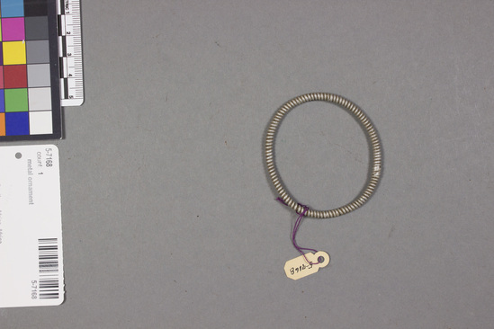 Hearst Museum object titled Bracelet, accession number 5-7168, described as Aluminum bracelet, 5.5 cms dia.