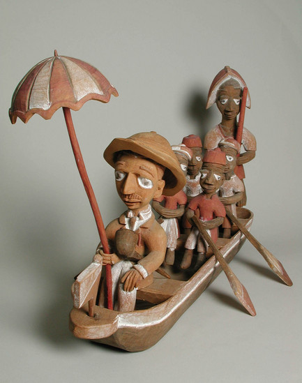 Hearst Museum object 3 of 15 titled Figures, accession number 5-16237a-q, described as caricature figure group; caricature of a District Officer on tour; carved & painted wood a - boat, has bag of frags b - Dist. officer (front) c - poler (rear) d - paddler (LF) e - paddler (LR) f - paddler (RF) g - paddler (RR) h - hat i - umbrella handle j - umbrella k - flag l - pipe m - pole n - paddle (RF) o - paddle (LF) p - paddle (LR) q - paddle (RR) Found two pegs in a bag with this object number.