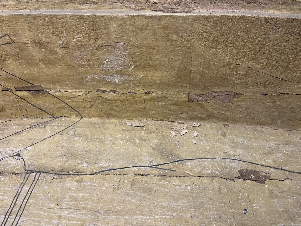 Hearst Museum object 26 of 167 titled Coffin, accession number 6-19912, described as Wooden anthropoid coffin. Inscription running down center of lid. Determined by Kea Johnston to probably be the outer coffin of Iwefaa (6-19928, 12-11039). According to Kea Johnston, "This coffin belonged to a man named Iwefaa, whose name is inserted in the middle of the spells written in the two columns on the front. This coffin is likely the outer coffin for PAHMA 6-19928 based on the similarity of the owner's name, unusual costume, and the paleography of the inscription. Both coffins were purchased on the antiquities market by George Reisner for Phoebe A Hearst. However, stylistically, they are very similar to a set of coffins known to have come from the site of Akhmim, which was excavated in the 1880s by Gaston Maspero, and which has heavily looted for the antiquities market during this decade." "The pectoral vignette between the text and the collar shows the deceased standing before squatting baboon and is the source of our logo. The hieroglyph for 'sky' is above their heads, and the side borders are formed by a pyramid and the symbol for the West.