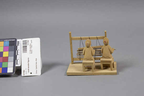 Hearst Museum object titled Figurine, accession number 9-17302, described as Model; two women weaving at loom