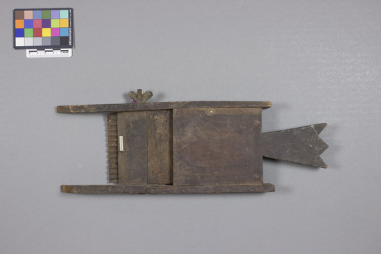 Hearst Museum object titled Cutter, accession number 9-11543, described as vegetable cutter; wooden frame with handle, fitted with two corrugated metal blades.  screw on one side allows for adjustment of blade angle. Length 33.5 cm, width 11 cm.