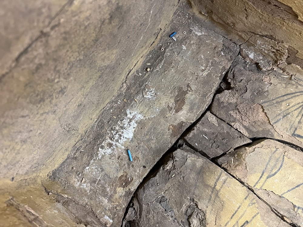 Hearst Museum object 72 of 167 titled Coffin, accession number 6-19912, described as Wooden anthropoid coffin. Inscription running down center of lid. Determined by Kea Johnston to probably be the outer coffin of Iwefaa (6-19928, 12-11039). According to Kea Johnston, "This coffin belonged to a man named Iwefaa, whose name is inserted in the middle of the spells written in the two columns on the front. This coffin is likely the outer coffin for PAHMA 6-19928 based on the similarity of the owner's name, unusual costume, and the paleography of the inscription. Both coffins were purchased on the antiquities market by George Reisner for Phoebe A Hearst. However, stylistically, they are very similar to a set of coffins known to have come from the site of Akhmim, which was excavated in the 1880s by Gaston Maspero, and which has heavily looted for the antiquities market during this decade." "The pectoral vignette between the text and the collar shows the deceased standing before squatting baboon and is the source of our logo. The hieroglyph for 'sky' is above their heads, and the side borders are formed by a pyramid and the symbol for the West.