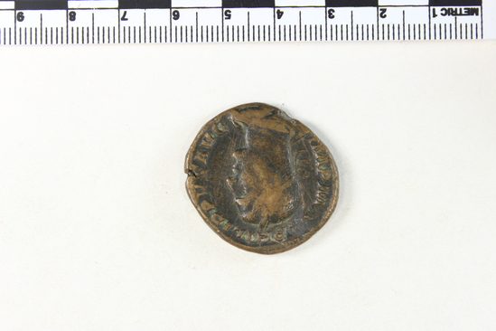 Hearst Museum object 5 of 8 titled Coin: æ sestertius, accession number 8-6243, described as Coin, Æ; Sestertius. 17.85 grams. Philippus Senior, 244-249 AD. Obverse: IMP M IVL PHILIPPVS AVG, Bust facing right, laureate, draped. Reverse: PM TRP II COS PP, SC in exergue, Emperor seated facing left on curule chair, holding globe in right hand and short scepter in left.