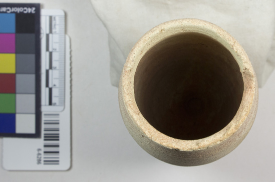 Hearst Museum object 3 of 5 titled Beer cup, accession number 6-6286, described as Pottery, deep pointed-bottomed buff cup, rim chipped: least diameter 5 cm, greatest diameter 6.5 cm, height 15 cm