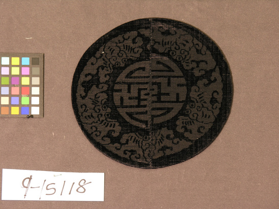 Hearst Museum object titled Lined piece, accession number 9-15118, described as Lined piece, round. Silk. Cut and uncut pile, patterned gauze weave lining. Black, black lining. 5 bats, good luck symbol design. 8 inch diameter.