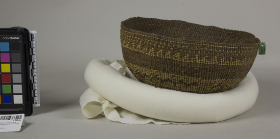 Hearst Museum object 2 of 2 titled Cap, accession number 1-10538, described as Cap basket; twined. Warp is possibly Hazel (Corylus cornuta californica), weft is Alder (Alnus rubra). White pattern is Beargrass (Xerophyllum tenax). Black pattern is Maidenhair (Adiantum pedatum).