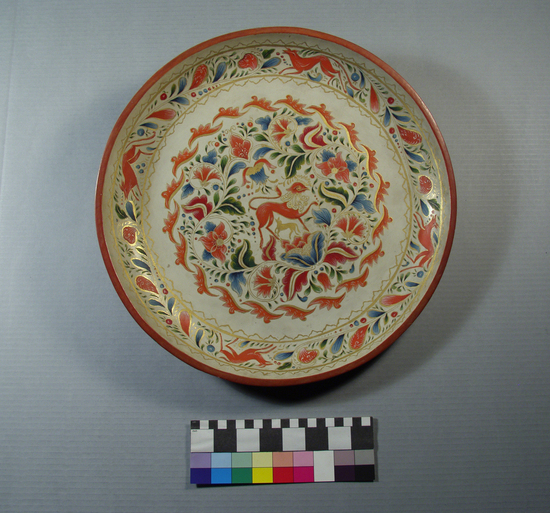 Hearst Museum object titled Tray, accession number 3-22900, described as lacquered wooden tray; interior painted designs of floral and animal motifs; red, blue, gree, and gold; 15 3/4 inches diameter; white background (interior), red rim, outside "charandar," brownish red