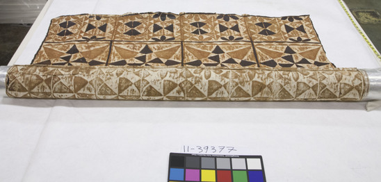 Hearst Museum object titled Tapa cloth, accession number 11-39377, described as Tapa, black and reddish-brown pigments, design with field squared off and filled with motifs made up of triangles and circles; example of a type exchanged or given in a malanga (tour), i.e. a visiting of villages by a group and an exchange of gifts and shells, a meeting place of chiefs, talking chiefs, etc.