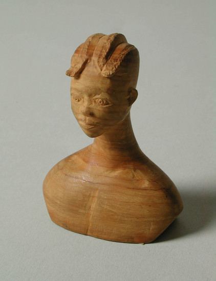 Hearst Museum object titled Thorn carving, accession number 5-16682, described as thorn carving, girl, bust only, hair with 4 rows of small flips in front.  by Akeredolu