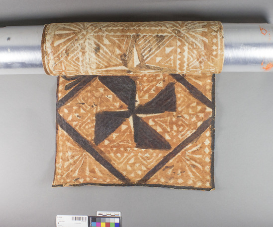 Hearst Museum object titled Tapa cloth, accession number 11-37192, described as Sample of tapa cloth; geometric and floral; 4 central design; maltese cross form; part of tapa has darker design.