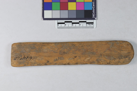 Hearst Museum object 7 of 9 titled Scribe's palette, accession number 6-14965, described as Scribe’s palette. Wooden slab; 2 depressions ( for red and black paint) and groove on 1 side (to hold a pen). length 16 cm.