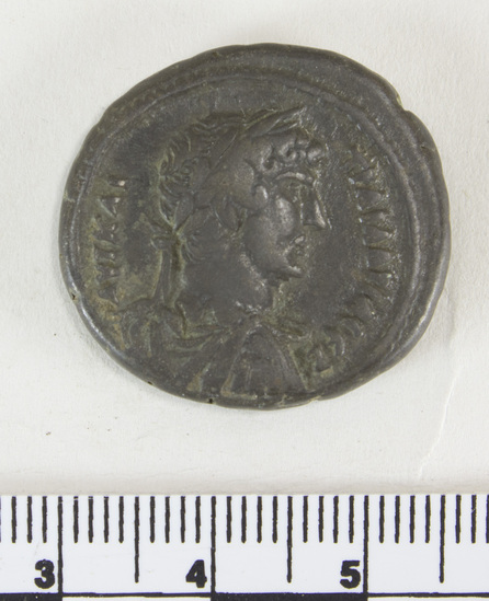 Hearst Museum object 5 of 6 titled Coin: billon tetradrachm, accession number 6-22590, described as obverse: head of Hadrian, right. laureate, wearing cloak and cuirass reverse: dikaioeyne standing left