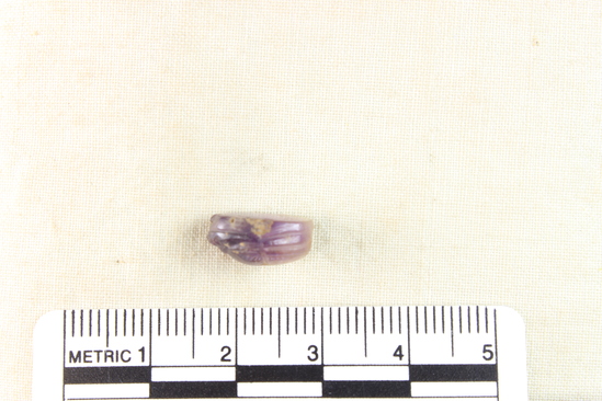 Hearst Museum object titled Scarab, accession number 6-13763, described as Amethyst scarab, uninscribed. Length 12.2 mm, width 8.3 mm, height 5.9 mm.