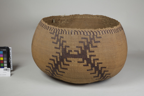 Hearst Museum object 2 of 2 titled Basket, accession number 1-28796, described as Twined. Brown overlay design with angular arms.