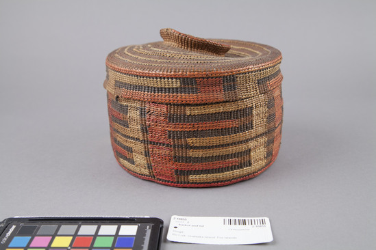 Hearst Museum object 2 of 2 titled Basket and lid, accession number 2-10855, described as Twined, with oblong design in red and yellow bands of blue on inside cover with design, rattle on knob of cover.