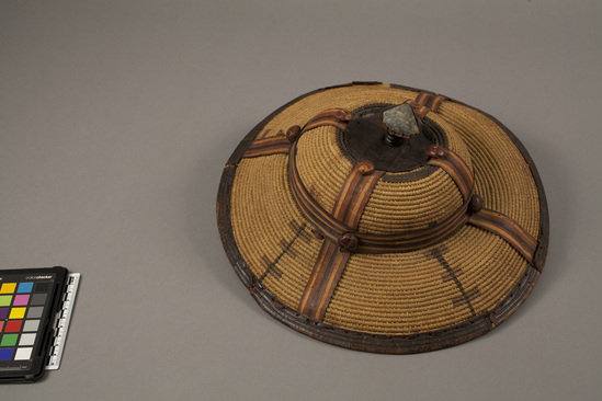 Hearst Museum object 1 of 2 titled Basketry hat, accession number 5-3408, described as Basketry hat; coiled; strips of leather trim; 12 inches diameter.