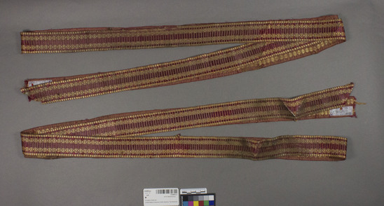 Hearst Museum object 2 of 2 titled Belt, accession number 2-62481a-e, described as 5 strips; soiled, silk, cotton, warp brocaded, “tobine,” colors red yellow warp, orange, light brown weft, Jacquard looms