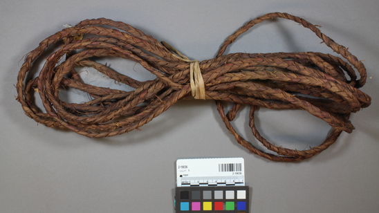 Hearst Museum object titled Rope, accession number 2-19036, described as Reddish brown, braided. Of bark fiber. 3 strand braided cedar bark.