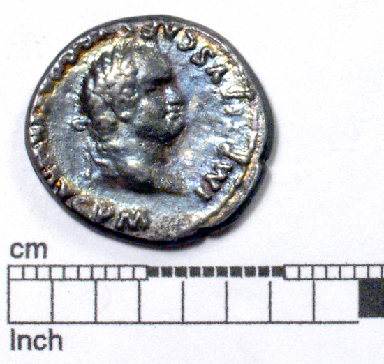 Hearst Museum object 1 of 8 titled Coin: æ denarius, accession number 8-5928, described as Coin: Denarius; (AR?) Æ; Titus - 2.56 grams. Rome, 80 AD. Obverse: IMP TITVS CAES VESPASIAN AVG PM - head laureate facing right. Reverse: TRP IX IMP XV COS JIII [line over the III] PP - Curule chair above which is a wreath.