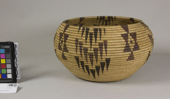 Hearst Museum object titled Bowl basket, accession number 1-70650, described as Coiled, bowl shape. Original label indicates "design: arrows, down hunt game of earth. Signal fire reflected.