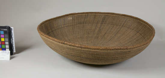 Hearst Museum object 2 of 2 titled Basket, accession number 1-28437, described as Openwork twined basket.  Shallow.  One brown band.