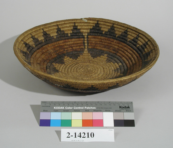 Hearst Museum object titled Basket, accession number 2-14210, described as Coiled, shallow. Circular red (faded) design with black triangular designs above and below. Opening left in design on one side.