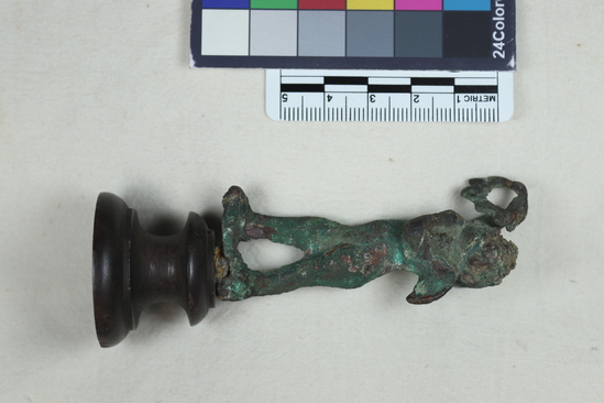 Hearst Museum object titled Statue fragment, accession number 8-3472, described as Cast bronze fragment of male forehead preserving locks of hair