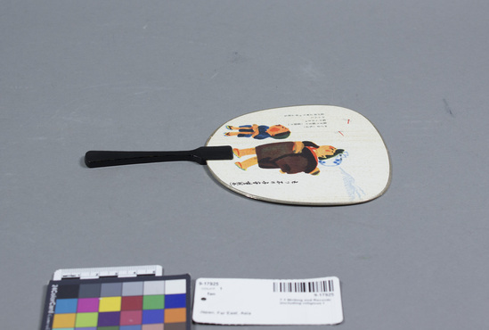 Hearst Museum object titled Fan, accession number 9-17925, described as fan, letter type; pictorial side shows two figures, 2 dragonflies, mountain in background; address side has birthday wish; paper with printed designs, black-lacquered wood handle; l. 19.3 cm.