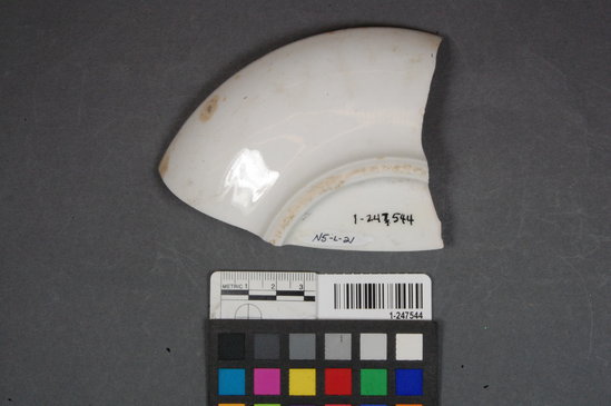 Hearst Museum object titled Ceramic platter fragment, accession number 1-247544, described as Ceramic platter; base rim refined white earthenware